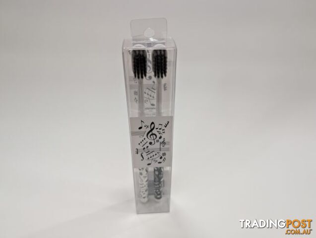 Two Toothbrushes with Music NotesClefs