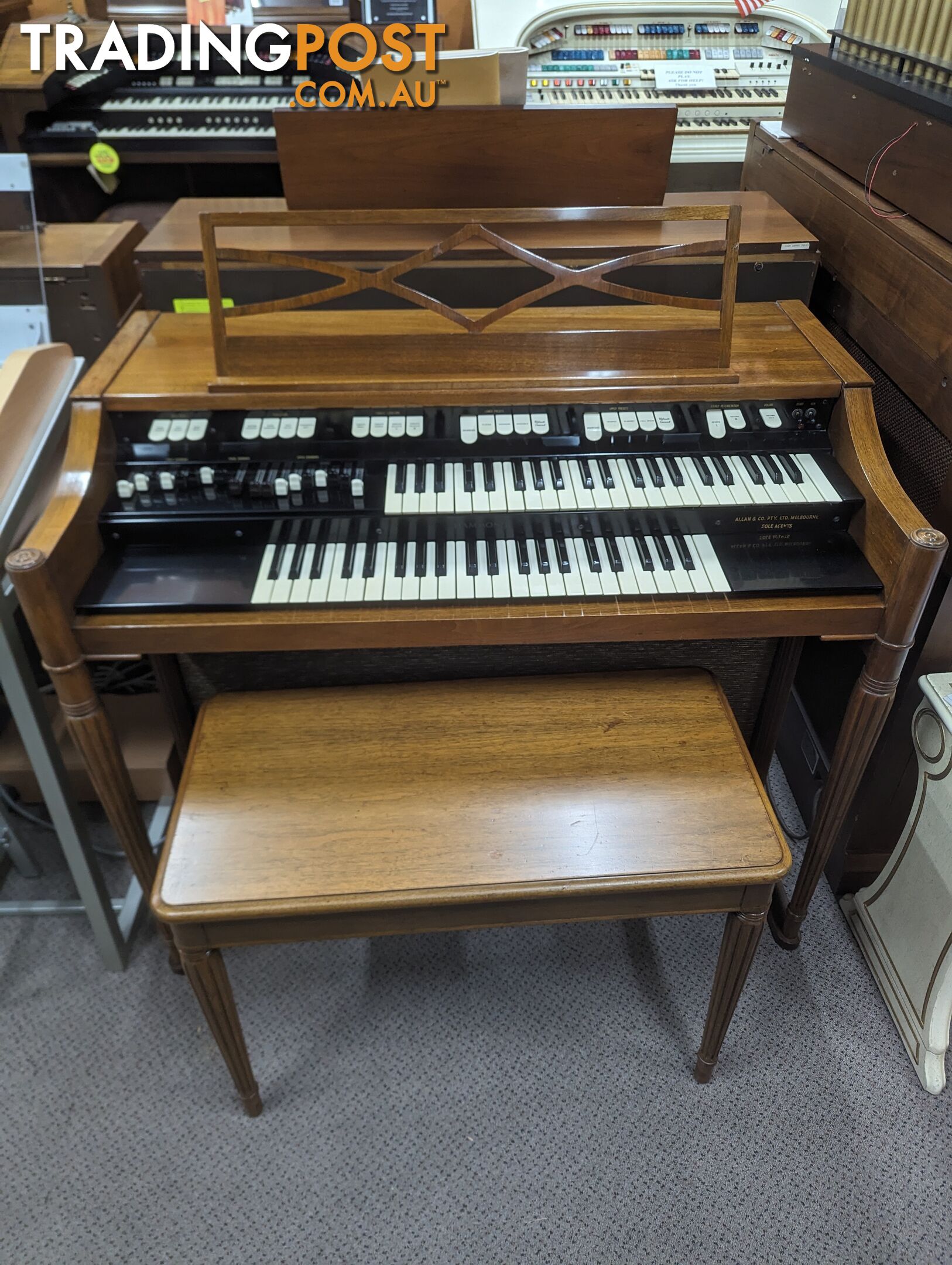 Hammond M100 Series Tone Wheel Organ - M-111, tradition style in walnut.