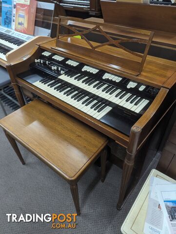 Hammond M100 Series Tone Wheel Organ - M-111, tradition style in walnut.