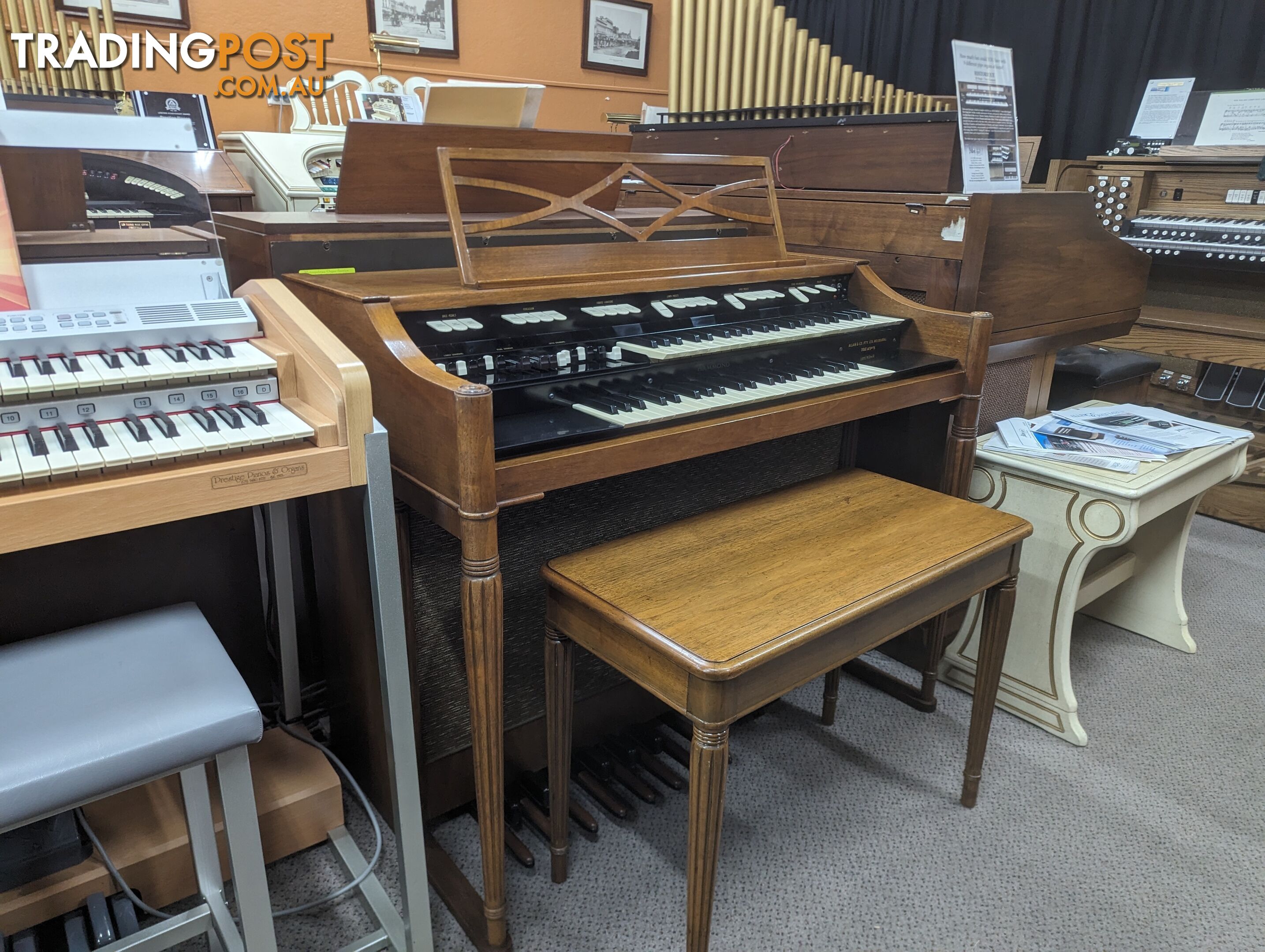 Hammond M100 Series Tone Wheel Organ - M-111, tradition style in walnut.