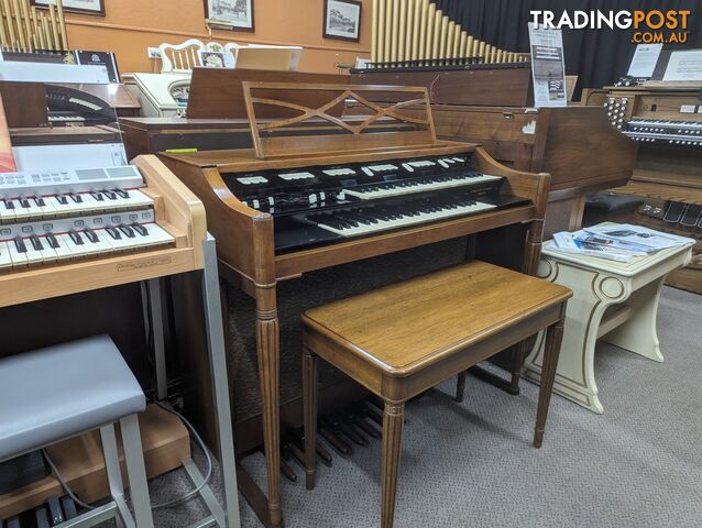 Hammond M100 Series Tone Wheel Organ - M-111, tradition style in walnut.