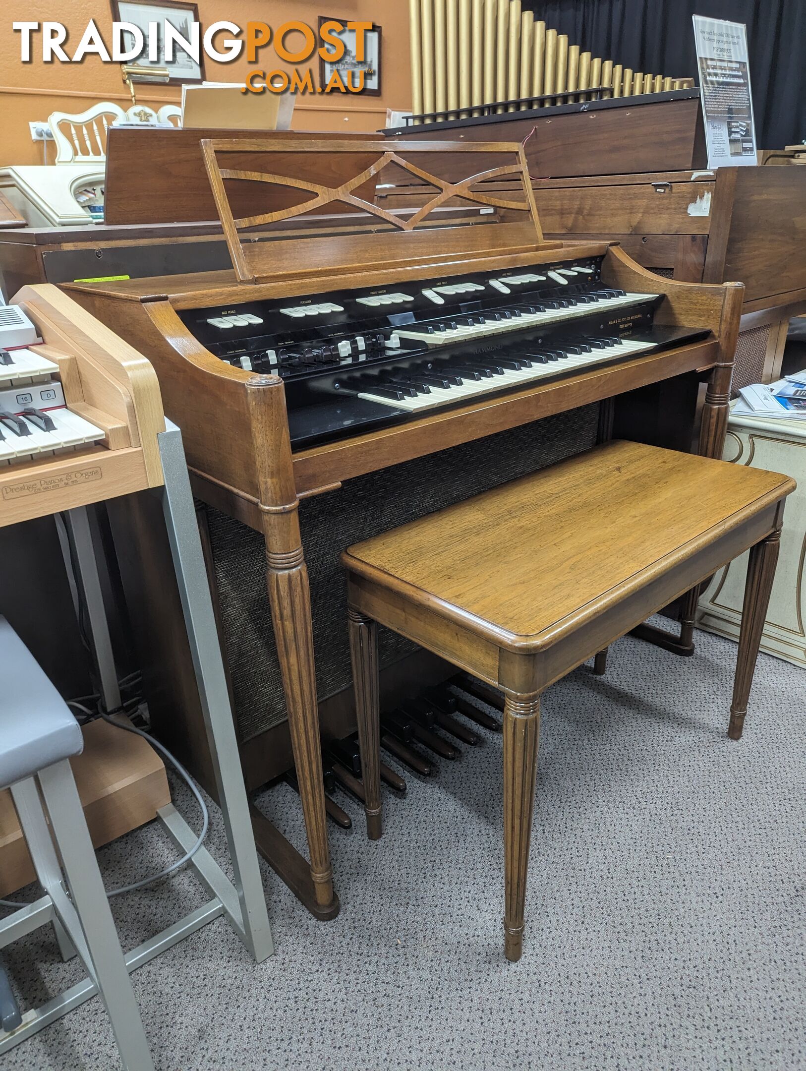 Hammond M100 Series Tone Wheel Organ - M-111, tradition style in walnut.