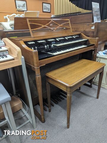 Hammond M100 Series Tone Wheel Organ - M-111, tradition style in walnut.