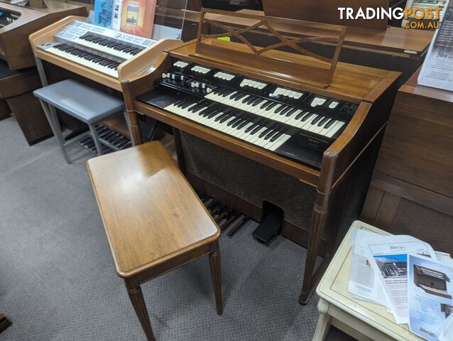 Hammond M100 Series Tone Wheel Organ - M-111, tradition style in walnut.