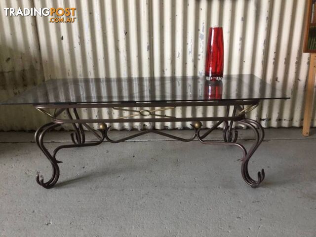 Coffee table glass top steel base. L 122 cm W 56cm H 44cm