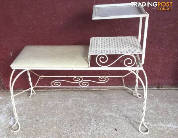 Wrought iron telephone table Slight surface rust. No damage to