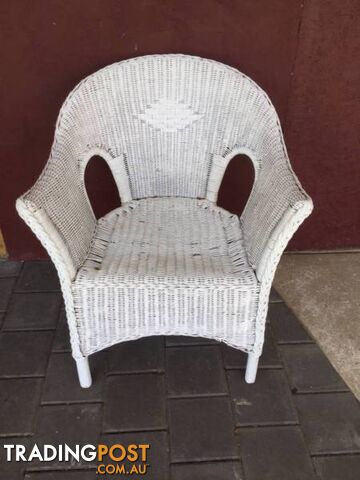 Wicker chair painted white. Needs painting. $20