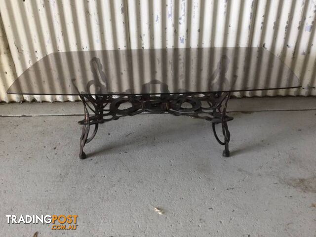 Coffee table metal base smoked glass top Base is made of tool M