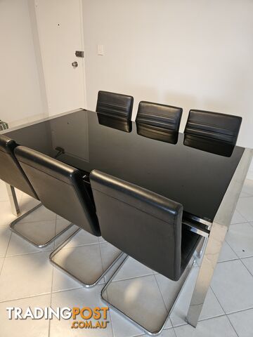 Dining room table with 6 chairs.