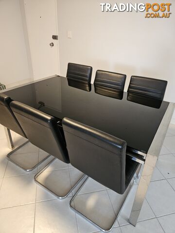 Dining room table with 6 chairs.