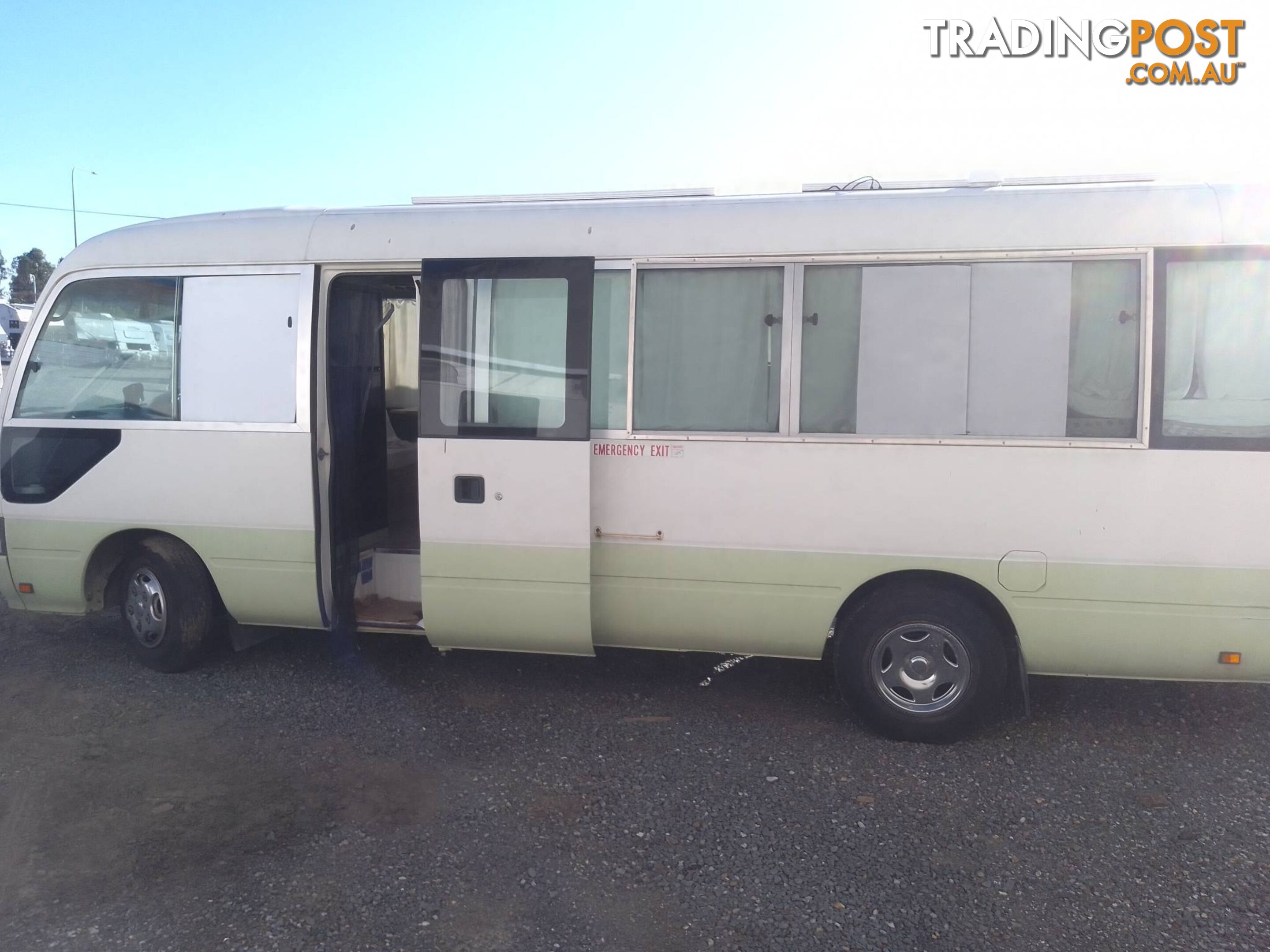 TOYOTA COASTER BUS DIESEL 6.6M TOURING MOTORHOME