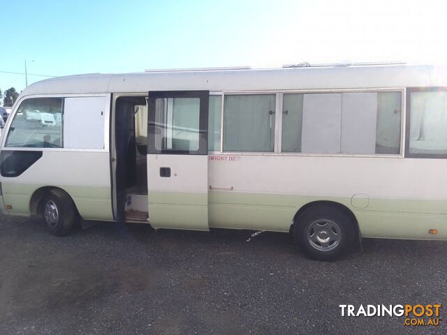 TOYOTA COASTER BUS DIESEL 6.6M TOURING MOTORHOME