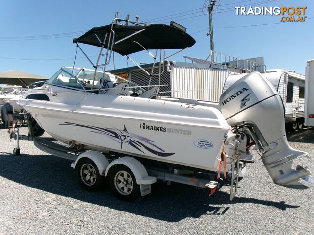 USED 2009 HAINES HUNTER 580 BREEZE POWERED BY A 2009 HONDA 4 STROKE 135 HP OUTBOARD ON AN EASYTOW DUAL AXLE TRAILER - photo 3 of 17
