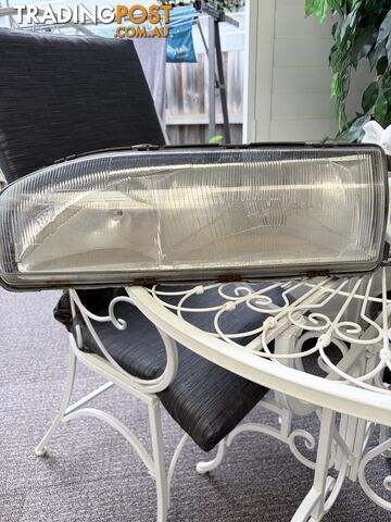 Holden VL front headlight left
