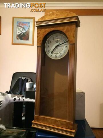 WALL MOUNTED CLOCK IN WOODEN CASE WITH GLASS DOOR