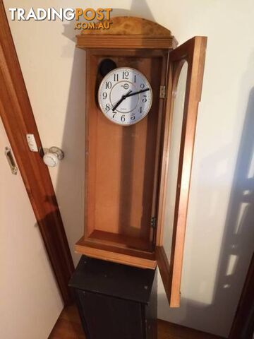 WALL MOUNTED CLOCK IN WOODEN CASE WITH GLASS DOOR