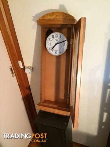 WALL MOUNTED CLOCK IN WOODEN CASE WITH GLASS DOOR