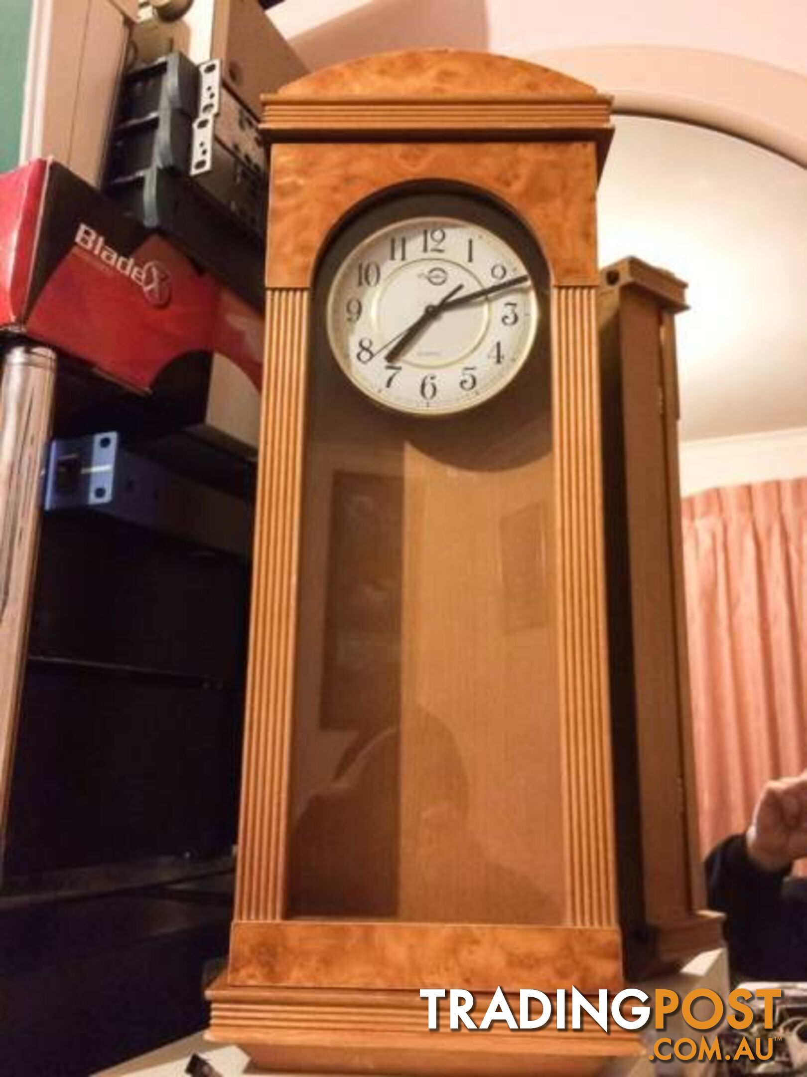 WALL MOUNTED CLOCK IN WOODEN CASE WITH GLASS DOOR