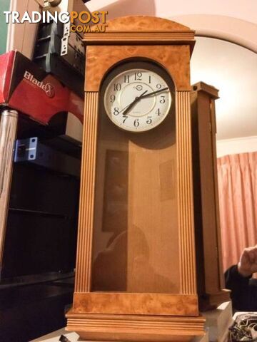 WALL MOUNTED CLOCK IN WOODEN CASE WITH GLASS DOOR