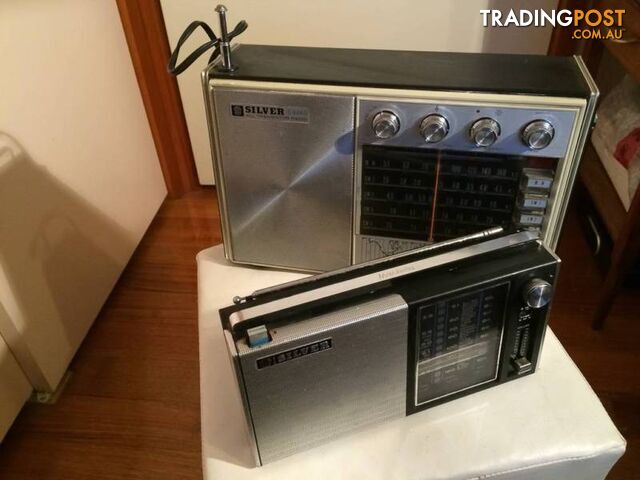 A PAIR OF SILVER VINTAGE RADIOS IN WORKING CONDITION