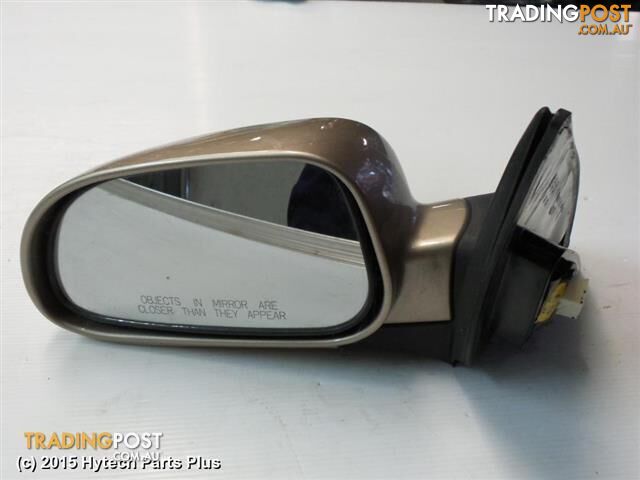 2006 HOLDEN VIVA LEFT DOOR MIRROR gold tested good scratch on edge