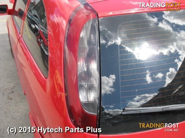 2005 HOLDEN BARINA LEFT FRONT DOOR red 3 park dents