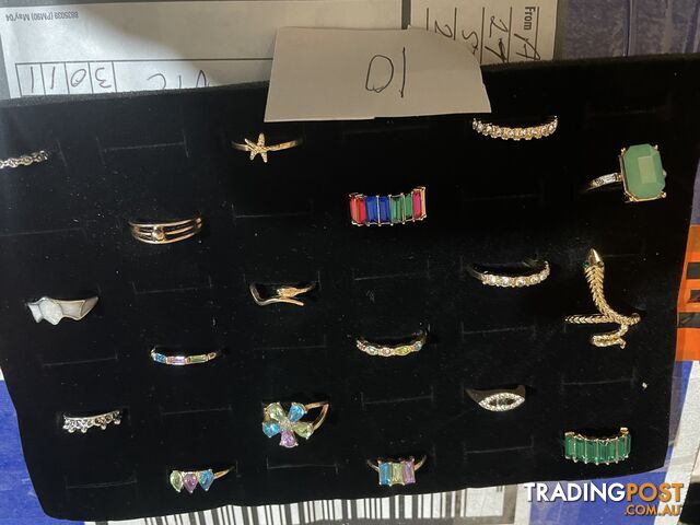 bulk lot of 18 fashion rings in display