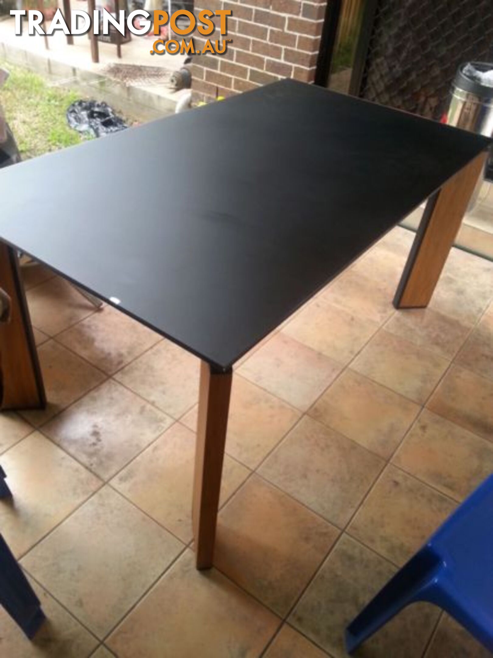 glass table with timber legs