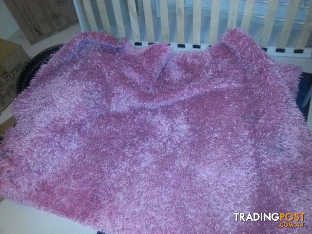 pink shaggy rug