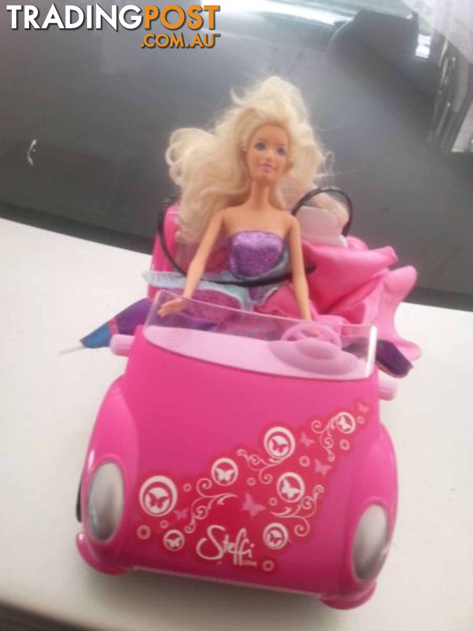 barbie and her car