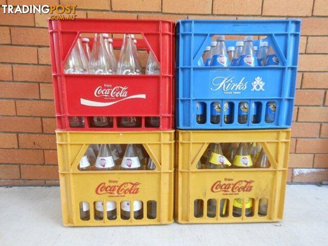 Soft drink crates with bottles and tops