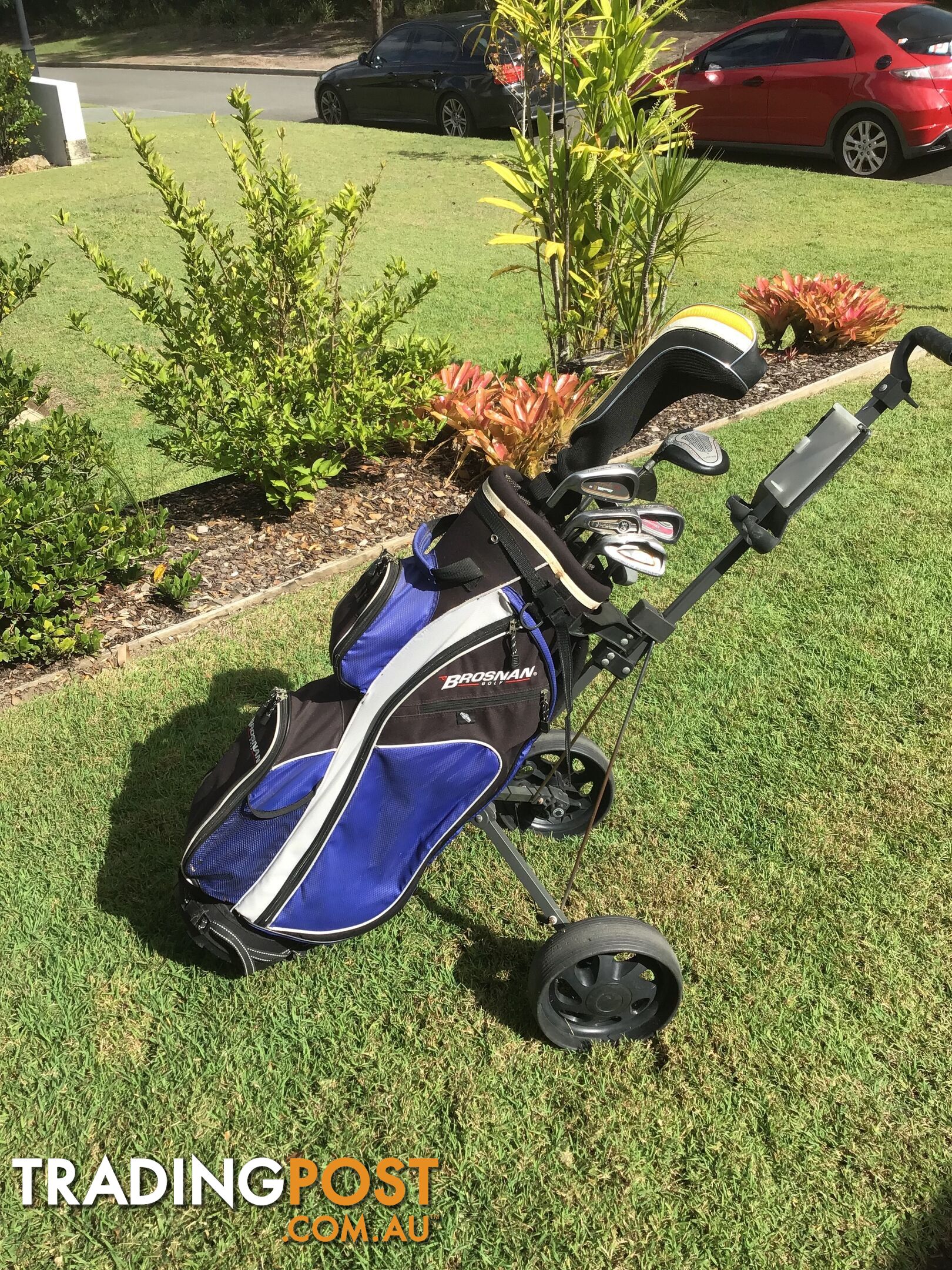 Left handed golf clubs, bag and trolley