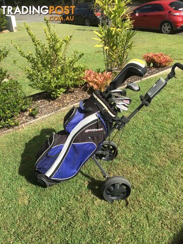 Left handed golf clubs, bag and trolley