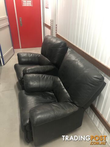 Two Black leather recliner chairs