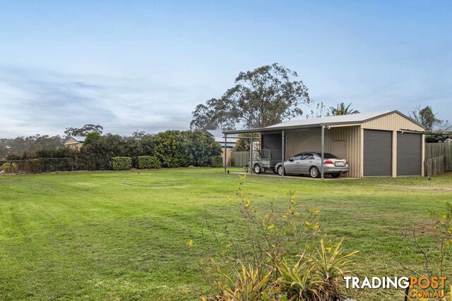6 Lewis Drive MERINGANDAN WEST QLD 4352 - photo 5 of 17