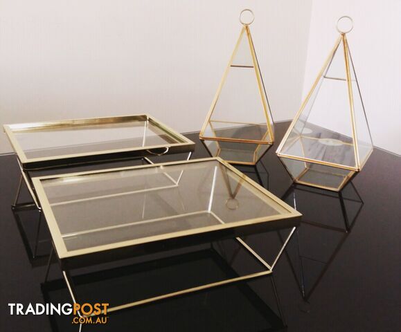 Gold rimmed glass risers and gold rimmed terrariums for hire!
