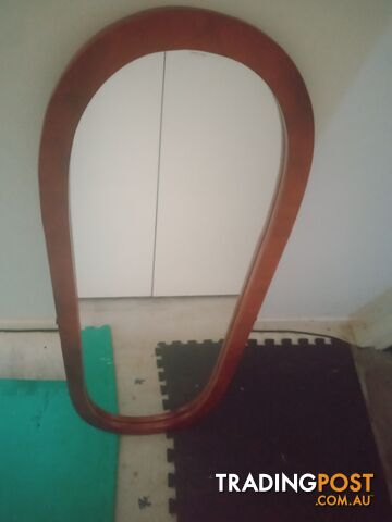 Standing mirror without stand .