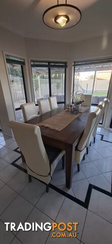 Dining table with 8 leather chairs