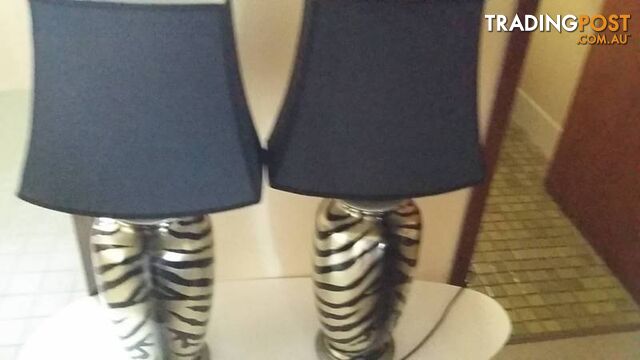 2 lamps with black stripes and shades