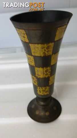small black and molten yellow vase