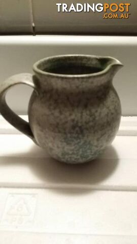 Motley coloured pottery jug