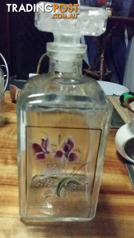 decanter with floral design on it