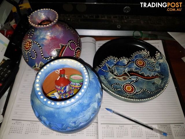 hand painted clay pots and plate