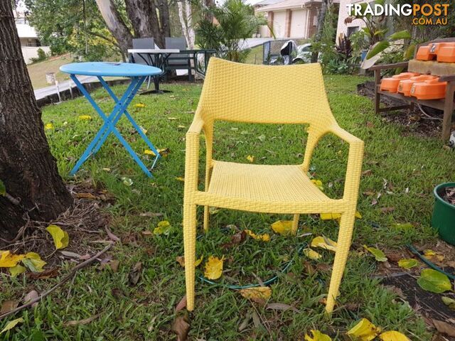 single yellow wicker chair