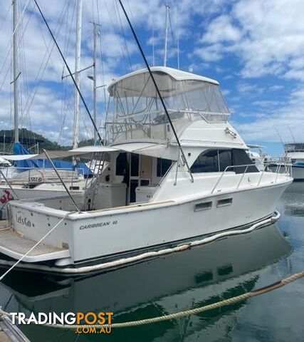 2006 CARIBBEAN 40 FLYBRIDGE BOAT, TWIN CUMMINS TWIN SHAFT DRIVE