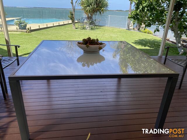 Glass dining table for outdoors