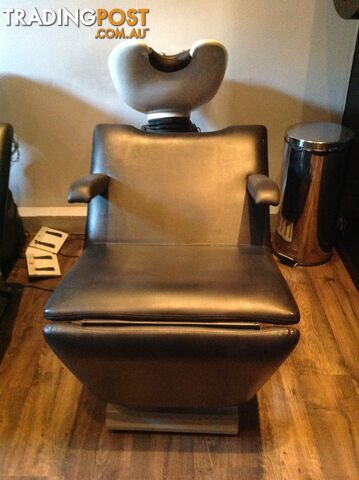 Black Salon Chairs with white oval basins.