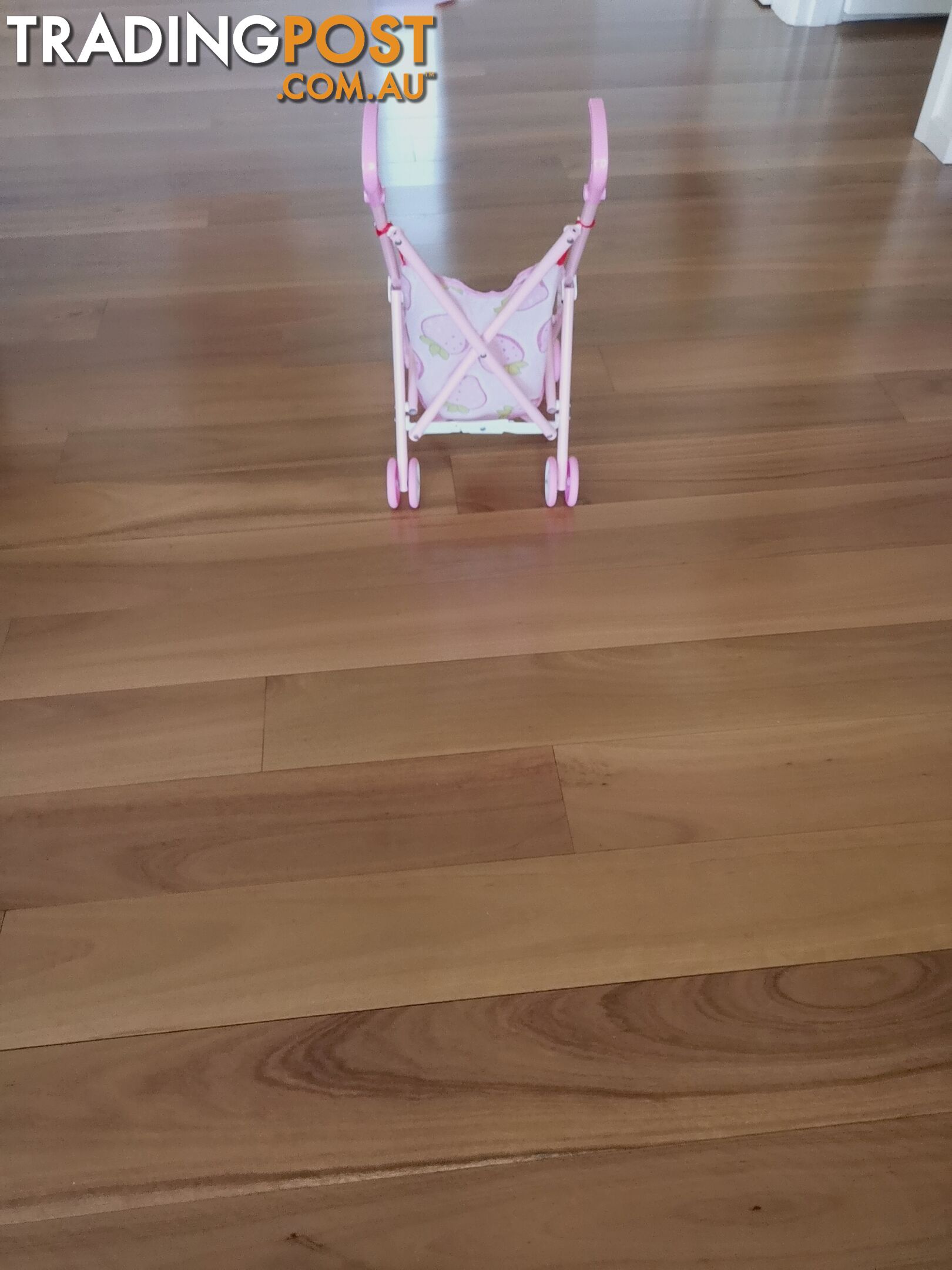 A pink toddler stroller is a favorite toy among little girls