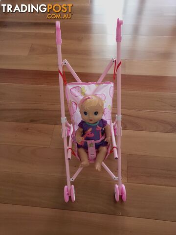 A pink toddler stroller is a favorite toy among little girls