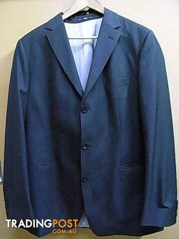 HUGO BOSS SUIT MADE IN USA. JACKET SIZE 44L pants 34 inch EXCEL